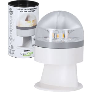 A geolocated emergency light in white and grey, featuring a dome design, with a branded packaging cylindrical box.