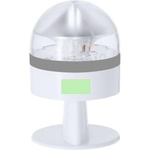 A compact white emergency light with a clear dome and a grey band, featuring an integrated stand and a branding logo.