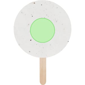 A round, white pai pai with a green centre and a wooden handle, designed for planting seeds.