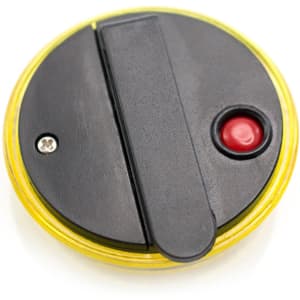 A round security light with a black top, a red activation button, and a yellow outer casing. It features a clip on the back.