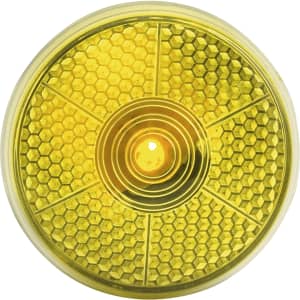 A round, yellow security light with a honeycomb pattern and a central light source, featuring a logo on the surface.