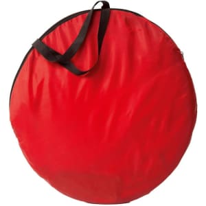 A round, red storage bag with a black handle, designed for convenience and portability.
