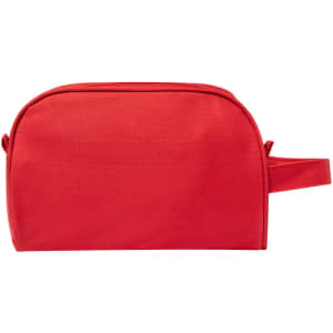 A rectangular red toiletry bag with a handle, featuring a simple design and a branding logo.