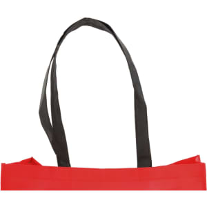 A red tote bag with black straps, featuring a simple design and a logo.