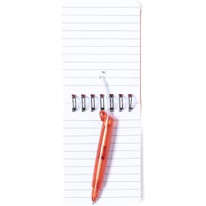 A miniature notebook with lined pages, featuring a spiral binding and an orange pen resting on top.