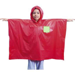 A red poncho with a hood displayed by a person, featuring a pocket and a logo.