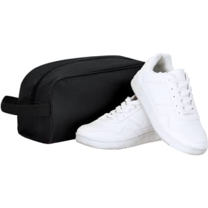 A black shoe bag beside a pair of white sneakers, featuring a simple design and a carry handle.