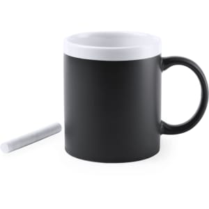A black coffee mug with a white rim and a piece of chalk beside it; features a logo.