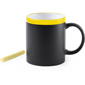 A coffee mug featuring a matte black exterior, a glossy yellow rim, and a piece of chalk beside it.