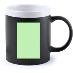 A coffee mug featuring a black exterior with a white interior and a blank green rectangle on the front.