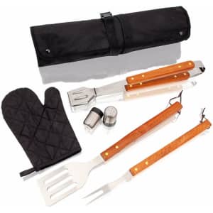 A black storage roll contains metal BBQ tools with wooden handles, a heat-resistant glove, and seasoning shakers.