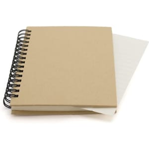 A spiral-bound notebook with a plain brown cover and lined pages peeking out from the front.