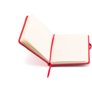 A red notepad with blank pages and a tied ribbon. It has a simple, sleek design.