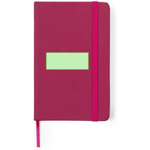 A maroon notepad with a pink elastic band and a blank green label on the front. It features a ribbon bookmark.