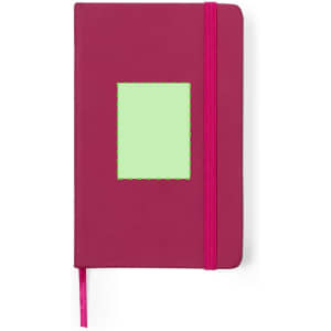 A magenta notepad with a green placeholder and a pink elastic band. Features a logo on the cover.