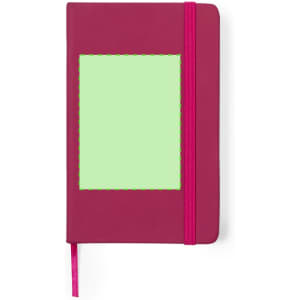 A magenta notepad with a green window panel and a pink elastic band closure. It features a ribbon bookmark.