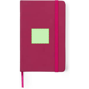 A magenta notepad with a green rectangular area and a pink elastic band closure.