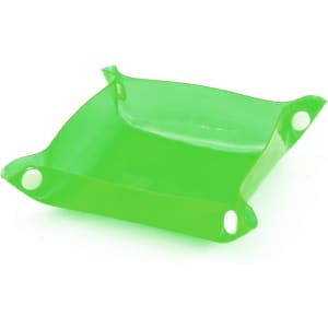 A green Flot Coin Tray with rounded corners and circular holes at the edges, made of translucent material.