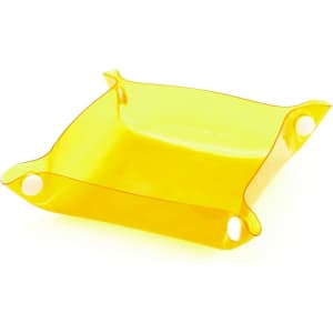 A yellow Flot Coin Tray with rounded corners and circular cutouts on each side, designed for holding small items.