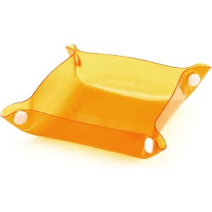 An orange Flot Coin Tray with a flexible design and rounded corners, featuring holes for easy handling.