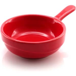 A red serving dish with a handle, featuring a smooth, glossy finish and rounded shape.