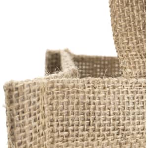 A jute bag with a natural brown texture, featuring sturdy handles and a simple design.
