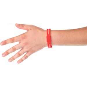 A red energy bracelet worn on a hand, featuring a simple design and an attached strap.