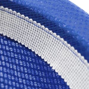 A close-up of a blue hat featuring a textured design and a contrasting white band. It has a logo on the side.