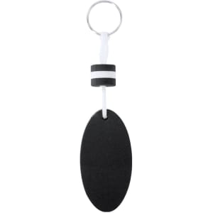 A black oval keyring with a white and black striped embellishment attached to a metal ring.