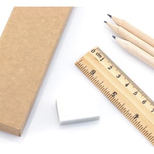 A brown cardboard box with a white eraser, wooden ruler, and three pencils in natural wood.