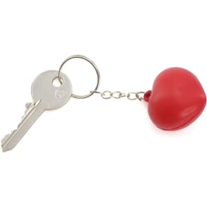 A red heart-shaped keyring attached to a metal key, connected by a silver chain.