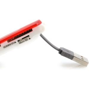 A red and white Dira Card Reader with slots for SD and micro SD cards, featuring a USB connection.