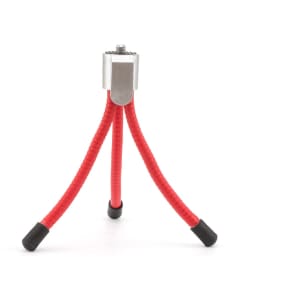 A small red tripod with flexible legs and a silver mount, featuring black rubber tips on the ends of the legs.