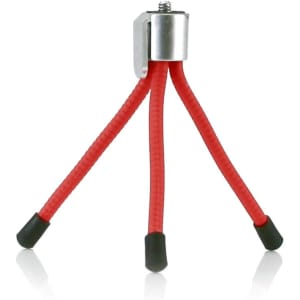 A red universal tripod with flexible legs and rubber feet, featuring a metallic top for securing devices.