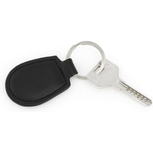 A black keyring with a protective cover and a metal key attached. The keyring has a circular attachment.