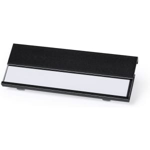 A name badge holder in black, with a white insert for customisation. It features a sleek, minimalist design.