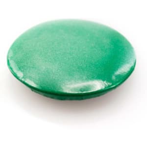 A green lapel pin with a shiny, smooth surface, featuring a circular shape. It has a logo on the back.