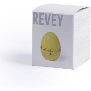 A yellow egg-shaped timer in a white box with a logo on the side, featuring measurement markings.