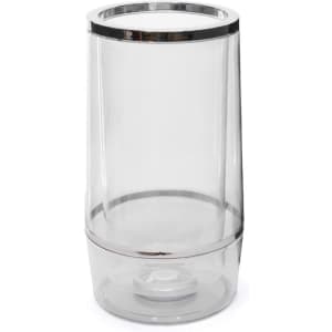 A drink bottle cooler made of clear plastic with a silver trim at the top and a rounded base.