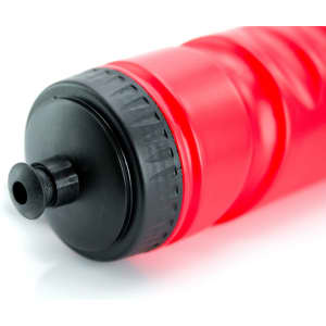 A drink bottle in vibrant red with a black cap and a nozzle, featuring a ridged design and a logo.
