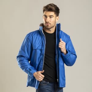 A blue rain jacket with a zippered front and a high collar, featuring a logo on the chest.