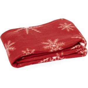 A red blanket with white snowflake patterns, neatly folded. It features a soft, plush texture.