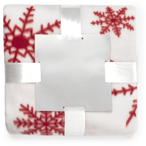 A white blanket with red snowflake patterns, neatly tied with a ribbon and featuring a branding logo.