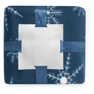 A blue blanket with a snowflake pattern, neatly folded and secured with straps. It features a blank white label.