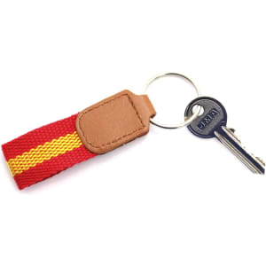 A red and yellow keyring with a brown leather tag and a metal keyring attachment.