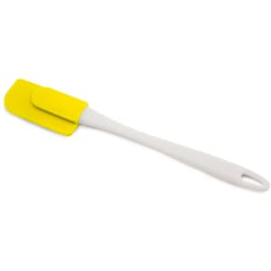 A Kerman spatula with a yellow silicone head and a white handle. The spatula has a sleek design with a hanging hole.