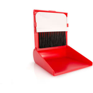 A red cleaning set featuring a dustpan with an integrated brush, designed for easy storage and use.