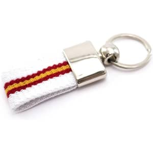 A keyring with a white fabric strap featuring red and yellow stripes, topped with a shiny metal attachment.