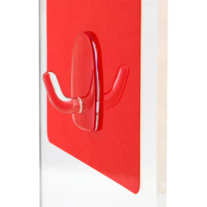 A clear, multipurpose hook in the shape of a double hook, mounted on a bright red backing. It has a logo.