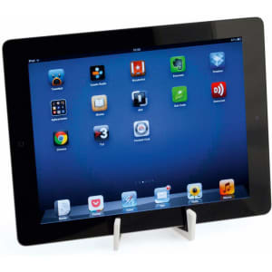 A tablet displayed on a white Laxo Holder phone stand. The background features a blue screen with various app icons.